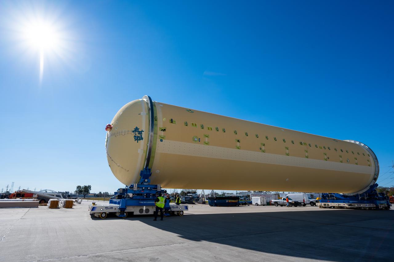Technicians transported the assembled upper part of the Artemis II core stage to the final assembly area inside the factory at NASA’s Michoud Assembly Facility in New Orleans. On Jan 10, the forward assembly, left was moved next to the Artemis II liquid hydrogen tank, which has been undergoing assembly. Next, Boeing, the lead core stage contractor, will join the forward assembly and the liquid hydrogen tank to complete most of the core stage for the Space Launch System (SLS) rocket that will send the first crew on an Artemis mission. The core stage consists of five major structures that are built, outfitted, and then connected to form the final stage. The forward skirt, liquid oxygen and intertank were connected and tested to form the 66-foot forward assembly. After the forward assembly is joined with the 130-foot liquid hydrogen tank, only the engine section, the fifth piece of the stage, will need to be added to complete the Artemis II core stage. The core stage serves as the backbone of the rocket, supporting the weight of the payload, upper stage, and crew vehicle, as well as the thrust of its four RS-25 engines and two five-segment solid rocket boosters attached to the engine and intertank sections. On Artemis II, the SLS rocket will launch the Orion spacecraft and a crew, sending them into lunar orbit, in preparation for later Artemis missions that will enable the first woman and first person of color to land on the Moon.